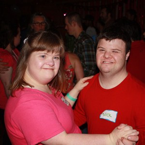 man and woman with downs syndrome dancing