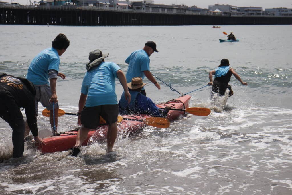 Day on the Beach participant headed onto the beautiful waters in a double kayak