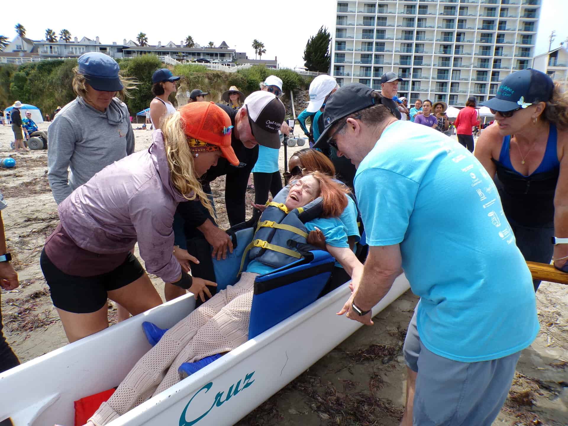 Day on the Beach participant getting ready to enjoy an outrigger canoe ride.